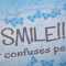 Schild  SMILE - IT CONFUSES PEOPLE